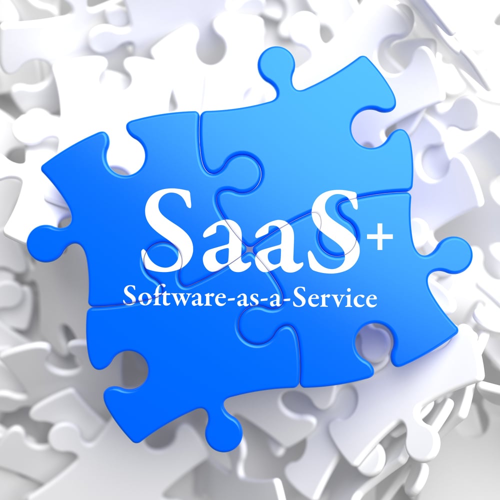 SAAS - Software-as-a-Service - Written on Blue Puzzle Pieces. Information Technology Concept. 3D Render.